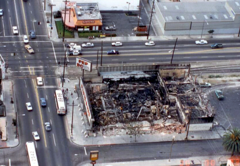 This 1992 crime scene photo provided by the Los Angeles Police Department shows a burned-out Pep Boys store, destroyed during the 1992 Rodney King riots in Los Angeles.